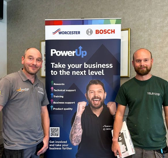 Neil and Tom Boother in front of PowerUp pull up at roadshow